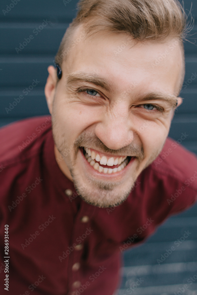 Portrait of cool happy young man wearing shirt Portrait of cool happy young man wearing shirt