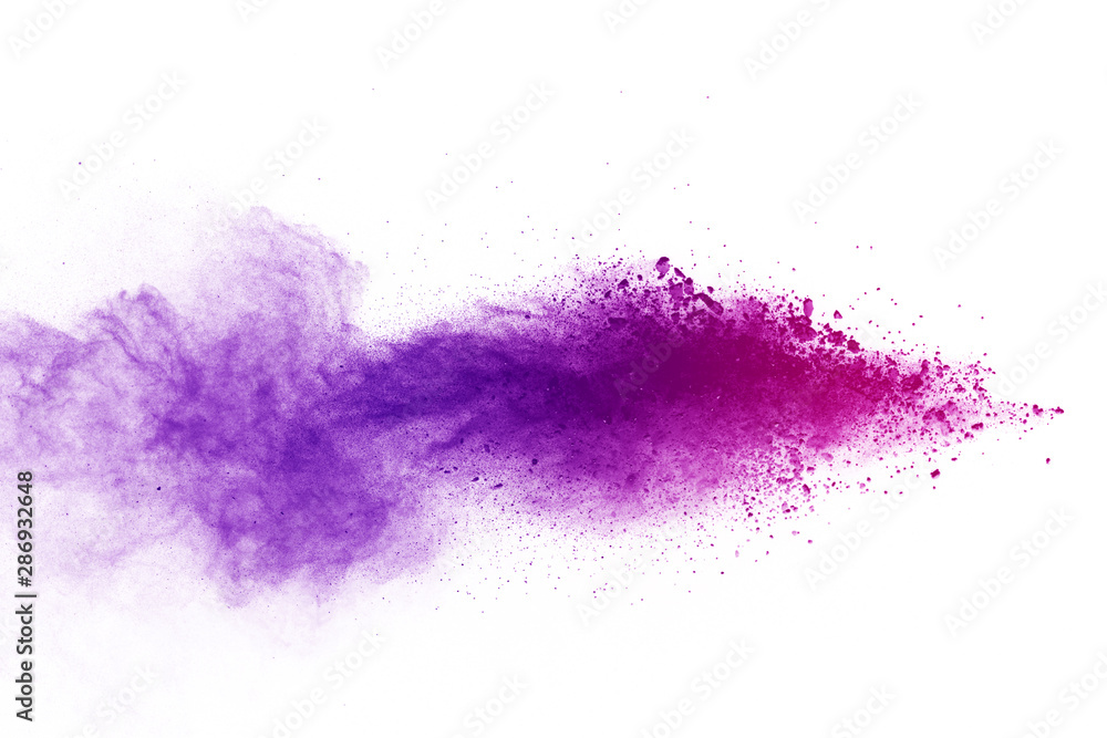 Freeze motion of purple color powder exploding on white background. Freeze motion of purple color powder exploding on white background.