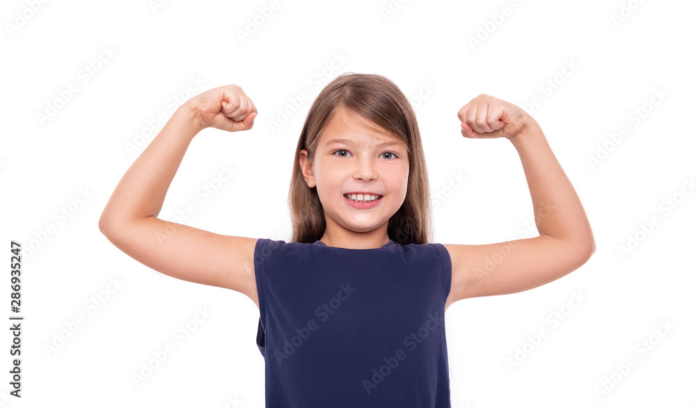 Little girl shows strength tensing muscles on a white background. Little girl shows strength tensing muscles on a white background.