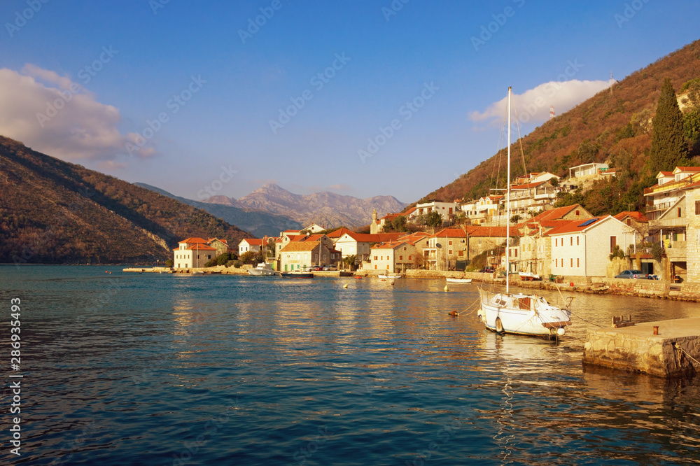 Naklejka premium Beautiful Mediterranean landscape. Montenegro, Adriatic Sea, view of Bay of Kotor and Lepetane village on sunny winter day