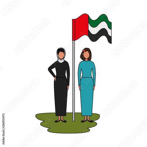 islamic women with traditional burka and arabia flag in pole