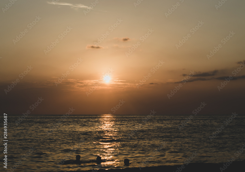 Sunset on a pebble beach with soft shadows