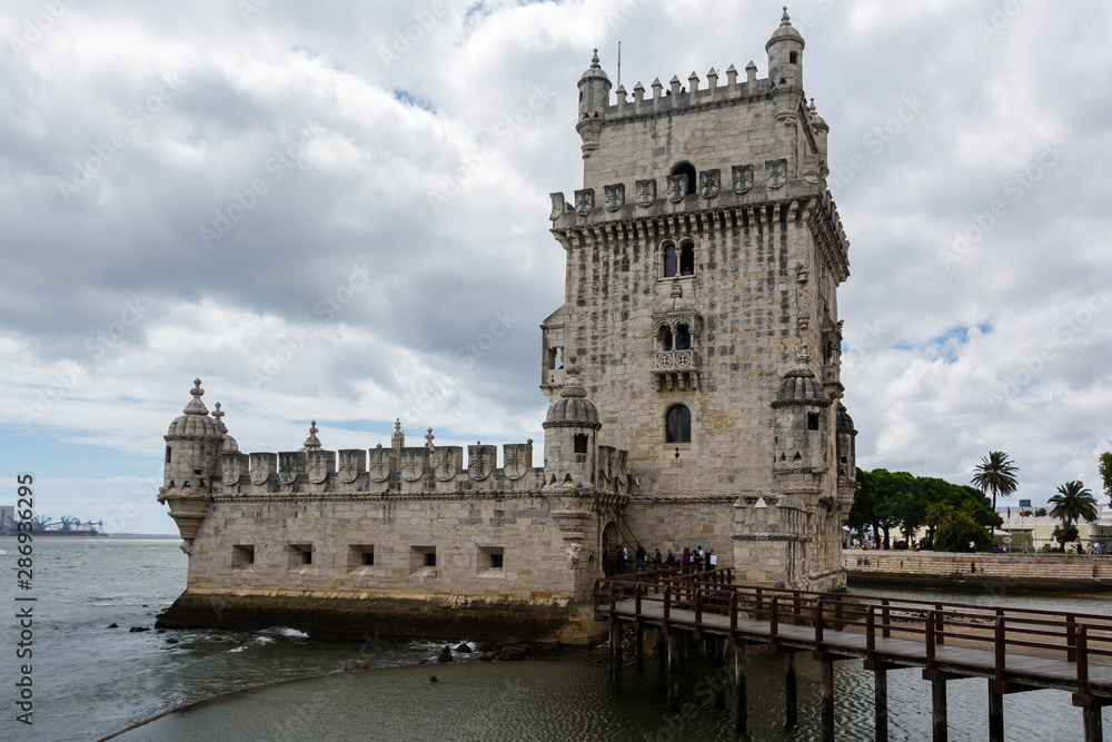 Belem Tower in Lisbon, Portugal with a cloudy sky