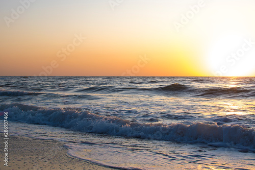 Sunset or dawn on the sea  waves and the sun.