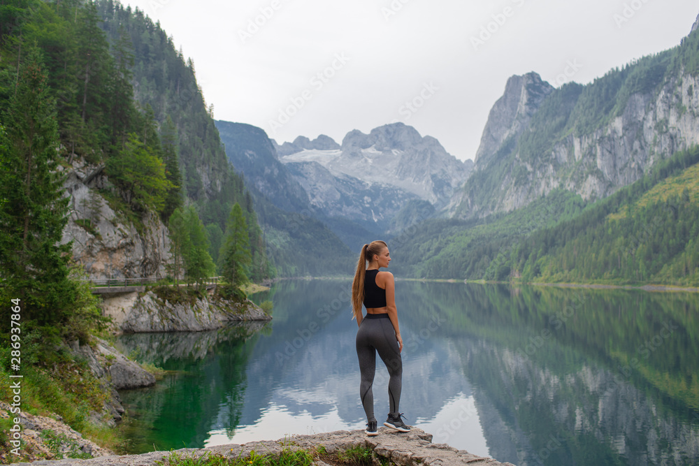 Young sports fitness girl in nature