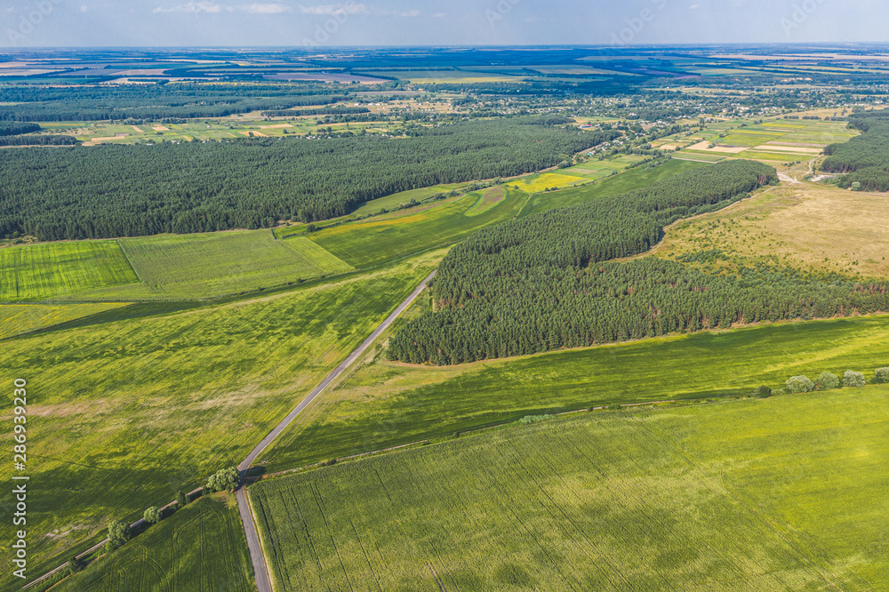 Aerial Flying over countryside at summer time. Wonderful drone photo for ecological concept