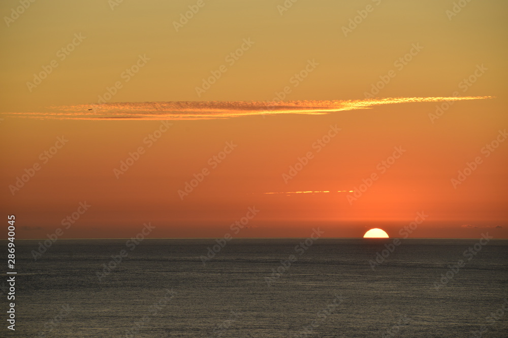 Warm sunset, Jersey, U.K. Summer coast setting.
