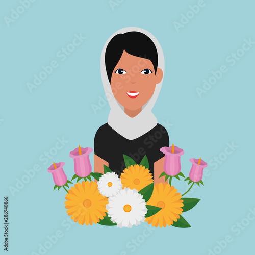 islamic woman with traditional burka and garden flowers
