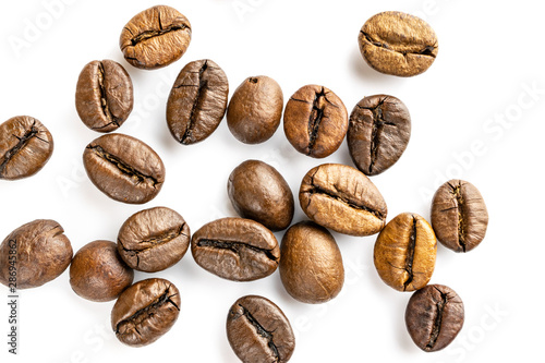 Roasted coffee beans isolated in white background cutout. Coffee background or texture concept.