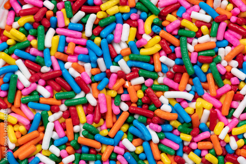 Fotografi Bright close up rainbow sprinkles background