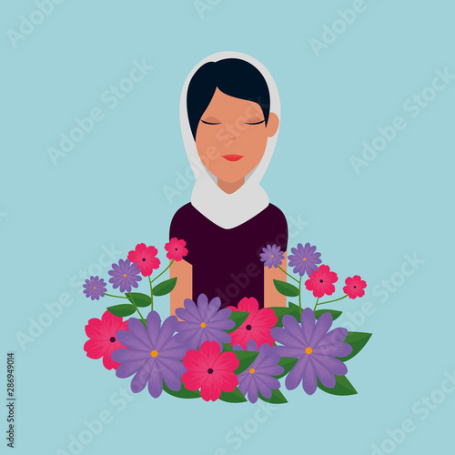 islamic woman with traditional burka and garden flowers