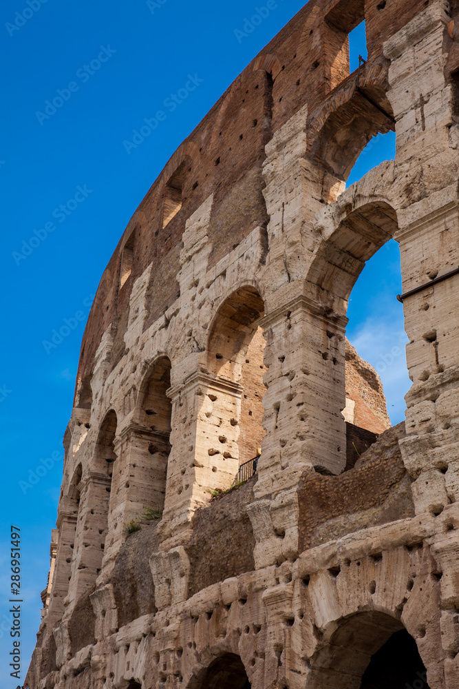 Detail of the  facade of the famous Colosseum or Coliseum also known as the Flavian Amphitheatre in the centre of the city of Rome