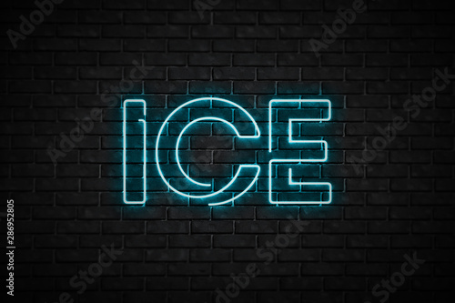 Light blue neon sign ice on a brick wall