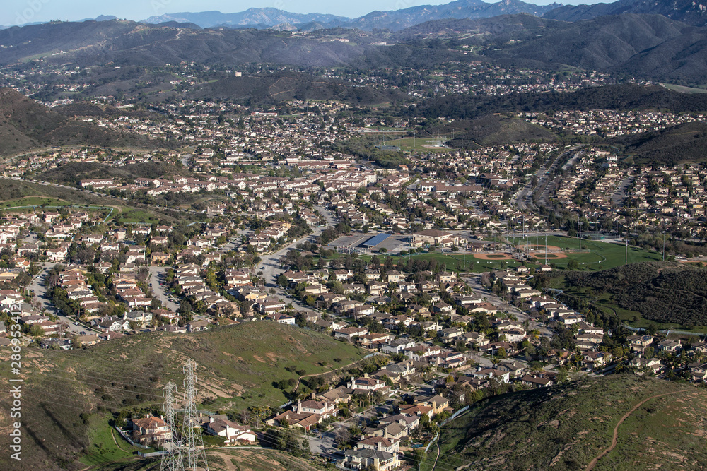 Aerial view of suburban valley homes near Los Angeles in the Newbury Park neighborhood of Thousand Oaks, California. Aerial view of suburban valley homes near Los Angeles in the Newbury Park neighborhood of Thousand Oaks, California.