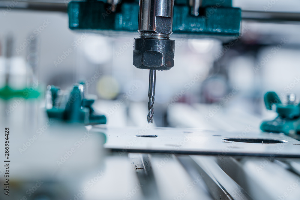 CNC milling machine cutting aluminium part. CNC milling machine cutting aluminium part.