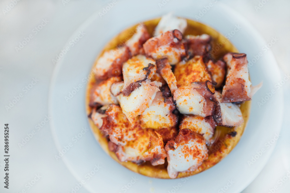 Pulpo a la Gallega also called Pulpo a Feira, this is Galician style cooked octopus and is the most iconic dish in the whole of the region. Pulpo a la Gallega also called Pulpo a Feira, this is Galician style cooked octopus and is the most iconic dish in the whole of the region.