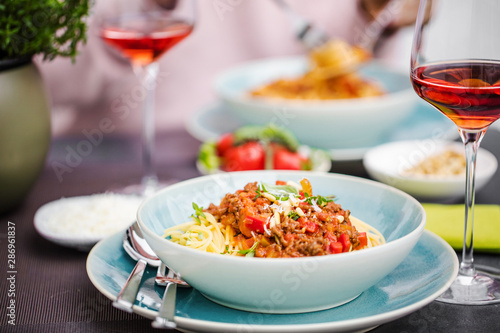 Spaghetti bolognese pasta with tomato sauce and   parmesan cheese and fresh basil