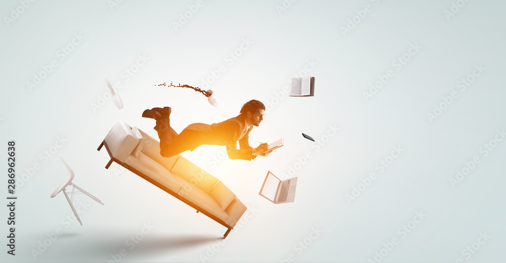 Fototapeta premium Joyful happe businessman levitating horizontally