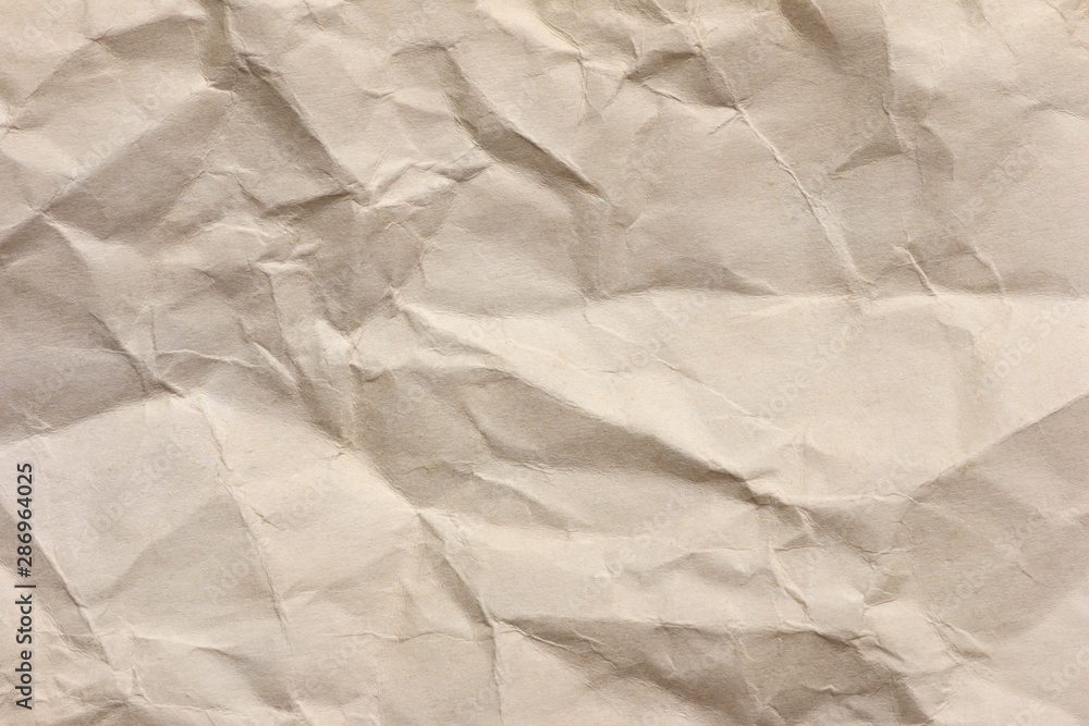 Fototapeta premium Clean brown paper, wrinkled, abstract for background.