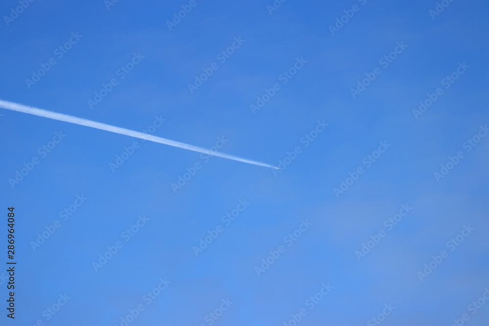 Airliner crossing the Pacific ocean in clean blue sky. Airliner crossing the Pacific ocean in clean blue sky.