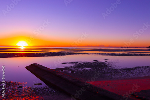Sunrise with purple water © Sam
