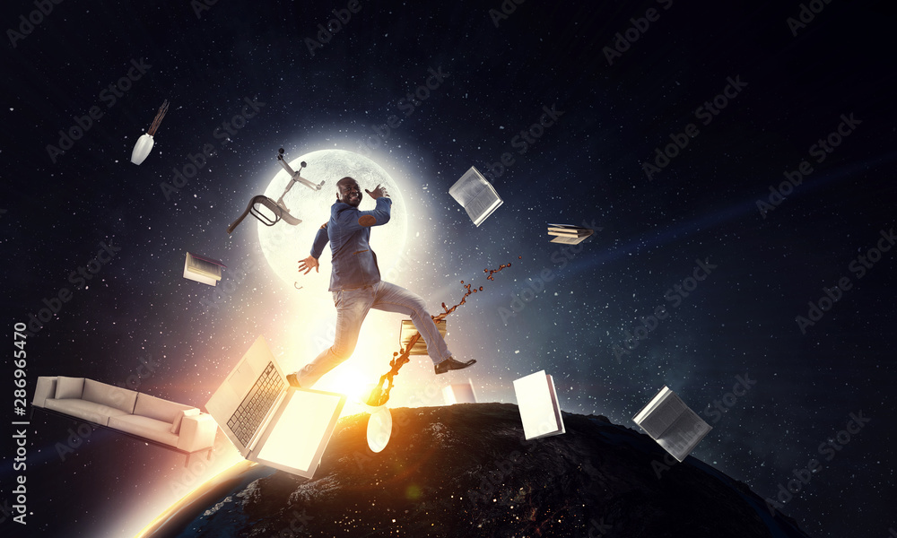 Naklejka premium Businessman jumping in gravity. Mixed media