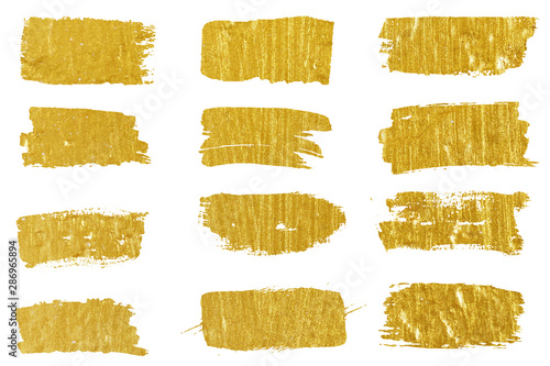 Collection of golden paint strokes. Grunge abstract hand painted element gold strokes with a brush.