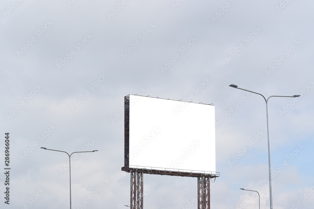 Billboard blank against blue sky background for outdoor advertising poster. Billboard blank against blue sky background for outdoor advertising poster.
