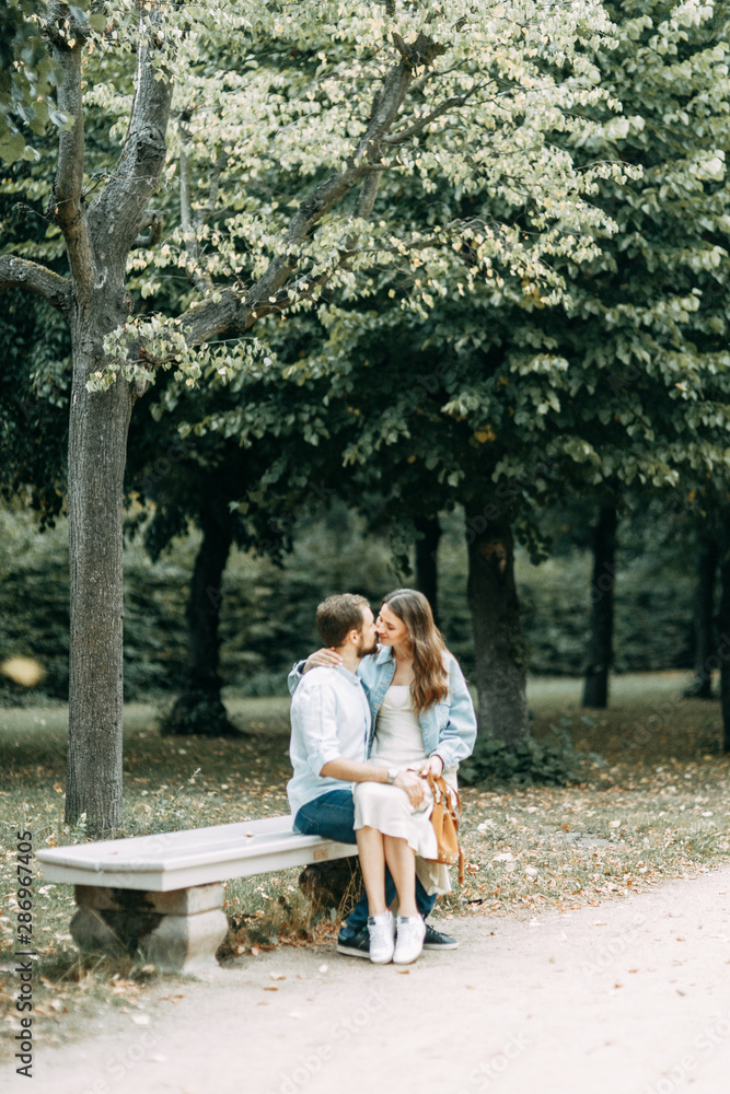 love story in Berlin.. couple sitting on a bench in the Park. love story in Berlin.. couple sitting on a bench in the Park.