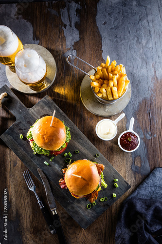 Photography Beef burger with fries and a refreshing pint of craft beer