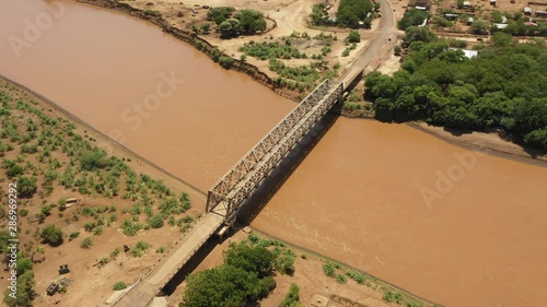 Africa infrastructure development and transportation - aerial drone shot of bridge over Omo river near border between Ethiopia and Kenya photo