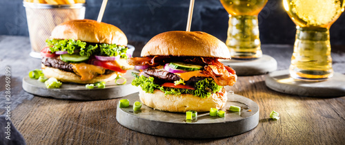 Beef burger with fries and a refreshing pint of craft beer 