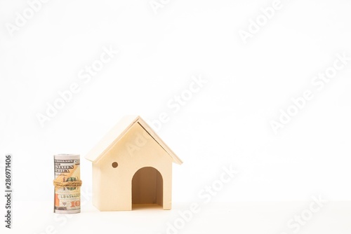 Miniature wooden house isolated against white background 