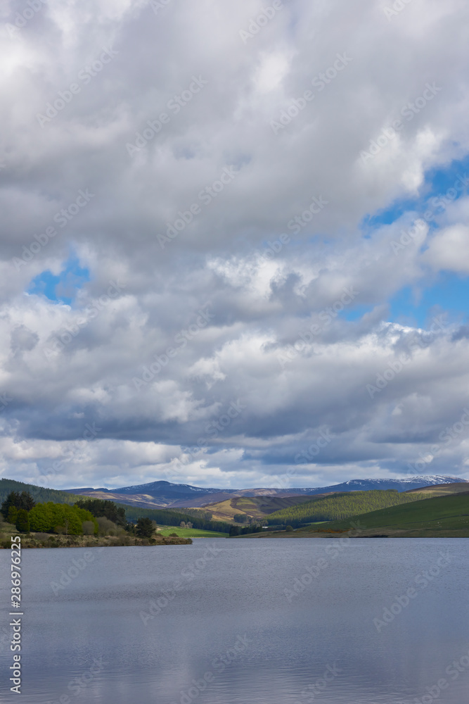 Backwater Reservoir set in the Angus Glens near to the town of Kirriemuir on a fine May morning. Angus Glens, Scotland.
