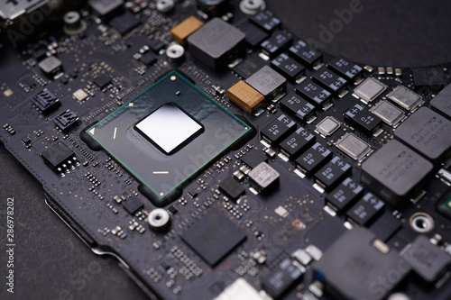 Wallpaper Mural A black colour waterproof Printed Circuit Board with CPU, SMD & IC mounted part on board Torontodigital.ca