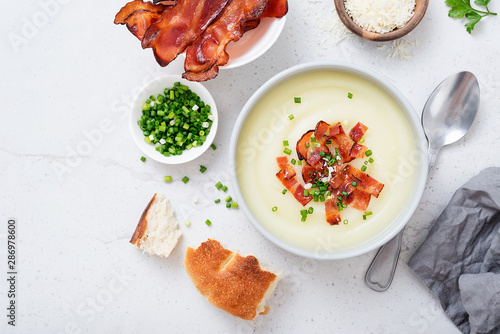 Potato cream soup with bacon, green onion and cheese.