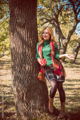 Autumn golden time, portrait of fashionable woman in park outdoors