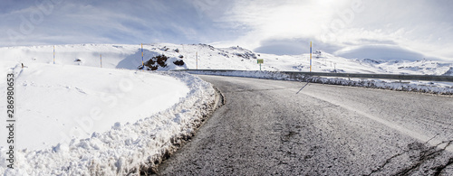 Road in ski resort of Sierra Nevada in winter, full of snow.