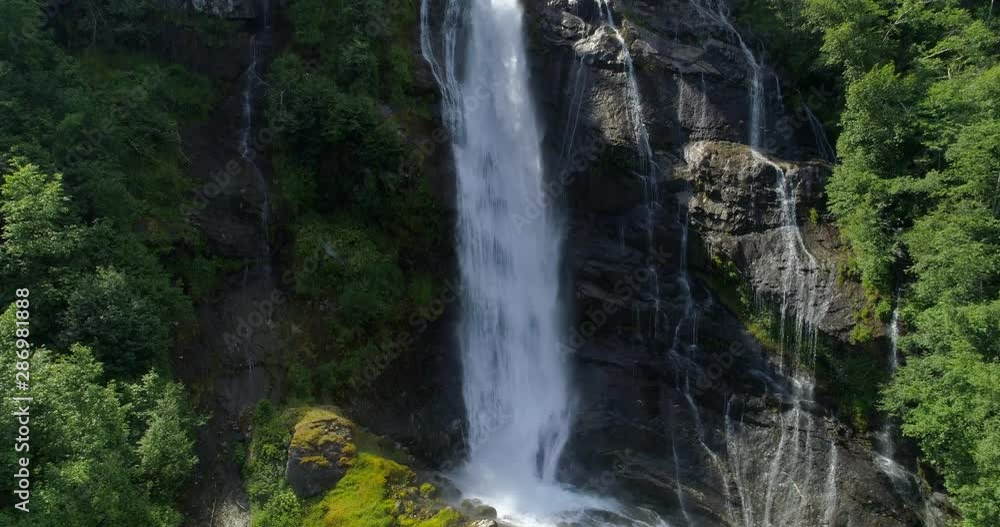 Drone: High angle view of waterfall flowing in stream - Geiranger Fjord, Norway Drone: High angle view of waterfall flowing in stream - Geiranger Fjord, Norway