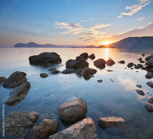 Beautiful sunset on the sea shore. © GIS