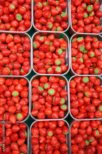strawberries in plastic box ready for sell