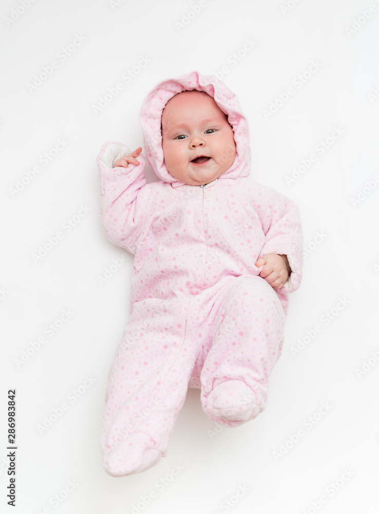 Cute baby dressed in warm overall for winter cold weather. Cute baby dressed in warm overall for winter cold weather.