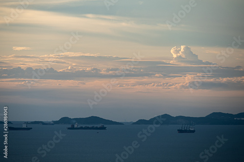 cargo ship on the sea on runrise. background concept for logisitic and transportation photo