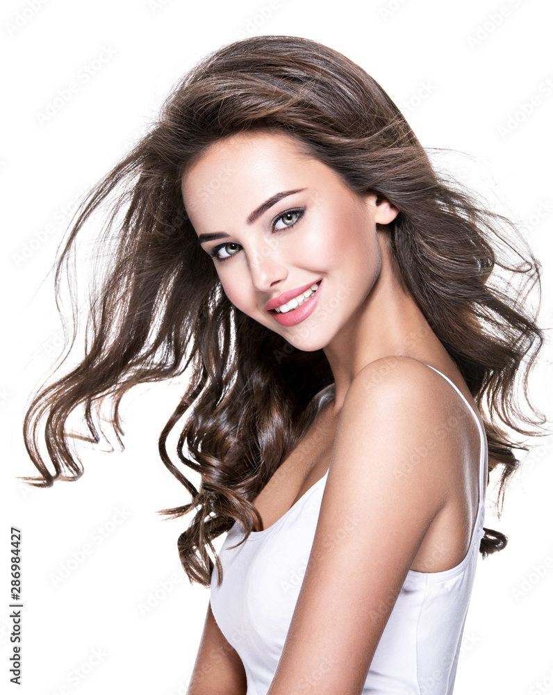 Beautiful laughing woman with long brown hair. Beautiful laughing woman with long brown hair.