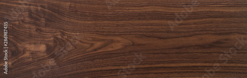 Texture of black walnut board with oil finish photo