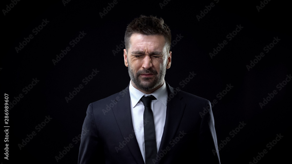 Scared man with closed eyes, post-traumatic stress disorder, phobia, trauma Scared man with closed eyes, post-traumatic stress disorder, phobia, trauma
