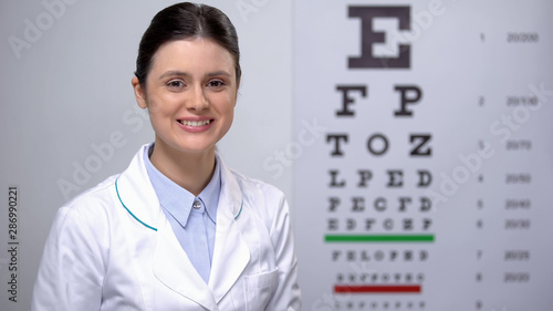 Lady ophthalmologist satisfied with eyesight eye chart test results, good vision