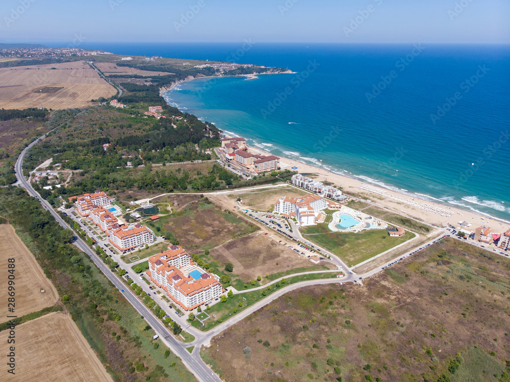 Aerial photo of the beautiful small town and seaside resort of known as Obzor in Bulgaria taken with a drone on a bright sunny day showing the hotels and fields of the holiday resort.