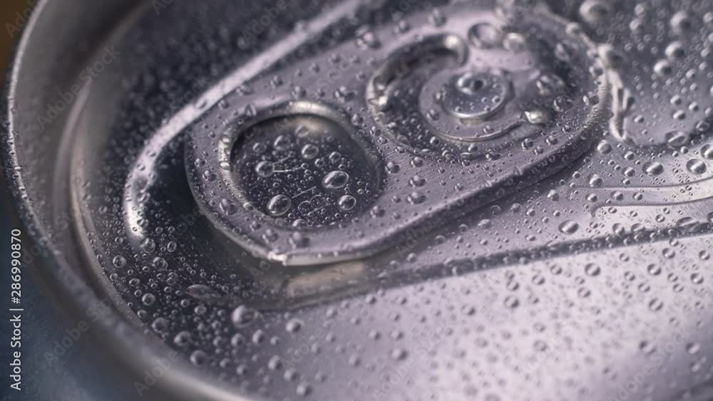 Panoramic shot of a wet aluminum can with a metal lid with drops of clear water on the surface. aluminum Can spinning. macro mode Panoramic shot of a wet aluminum can with a metal lid with drops of clear water on the surface. aluminum Can spinning. macro mode