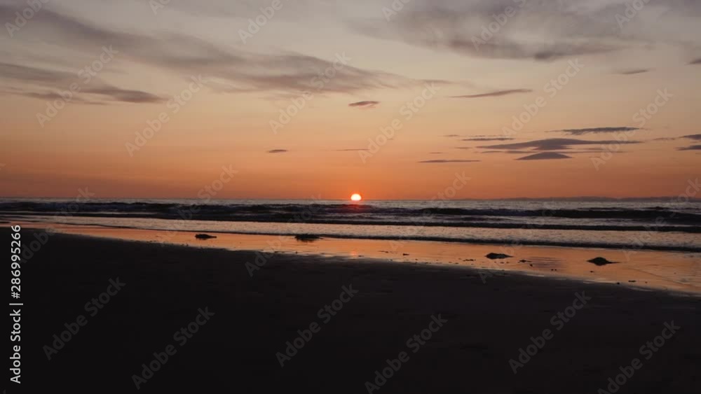 Man running with guitar in back sand beach at sunset. Beautiful, moody shots from the Sony a7iii. Man running with guitar in back sand beach at sunset. Beautiful, moody shots from the Sony a7iii.
